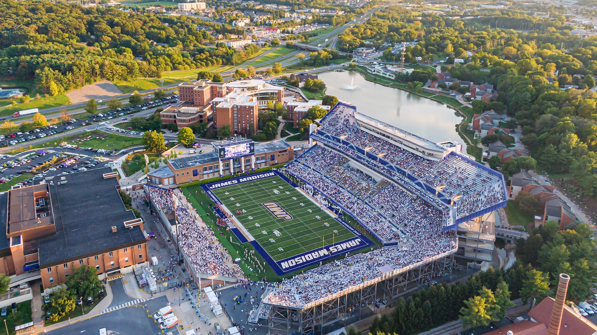 An aerial view of the filled James Madison University football stadium.