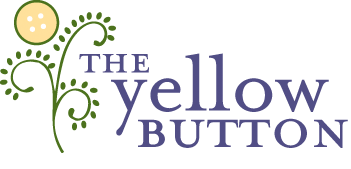 The yellow button logo.